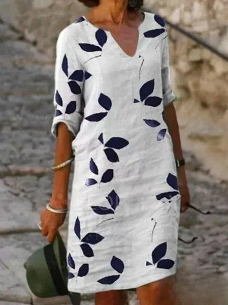 Damska sukienka w kwiaty z rękawami 3/4